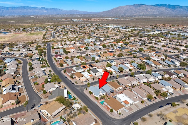 drone / aerial view with a mountain view and a residential view