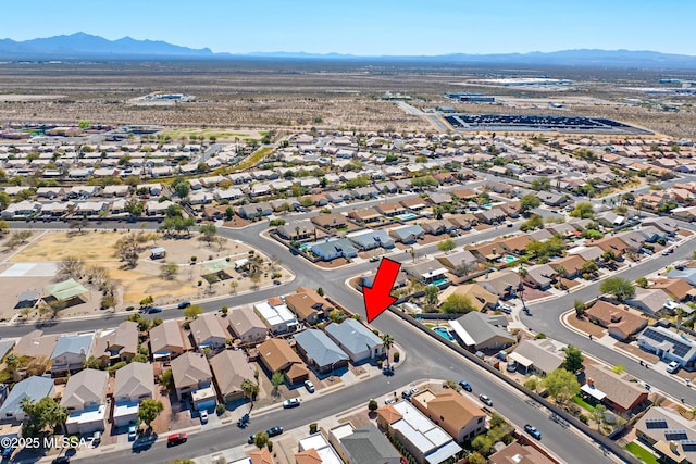 birds eye view of property featuring a mountain view and a residential view