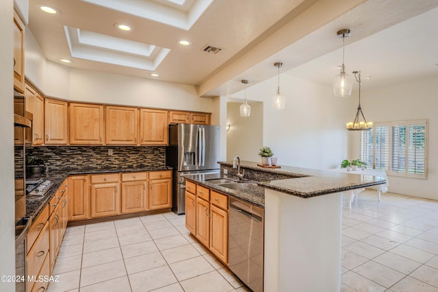 kitchen featuring visible vents, dark stone countertops, tasteful backsplash, stainless steel appliances, and a raised ceiling