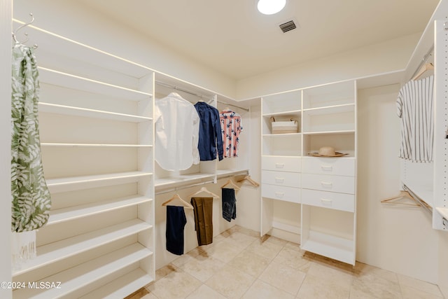 walk in closet with tile patterned floors and visible vents