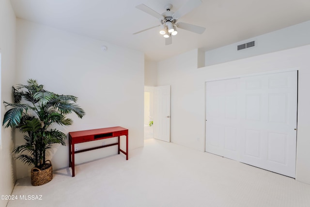 sitting room featuring carpet flooring, visible vents, and ceiling fan