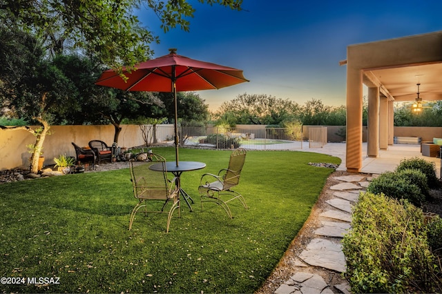 view of yard featuring a patio area and a fenced backyard