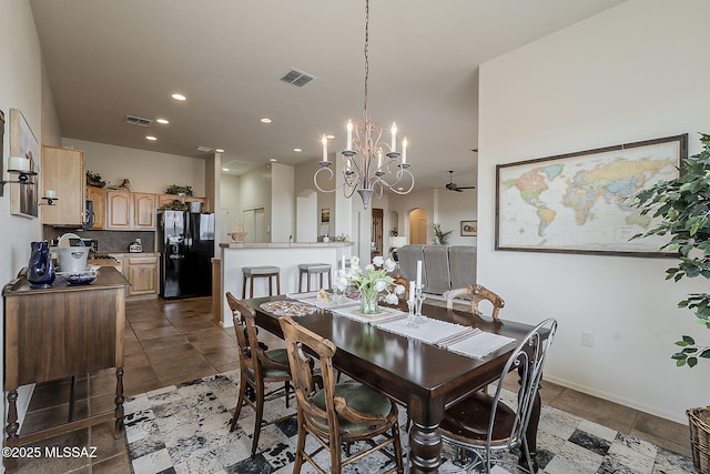 dining area featuring recessed lighting, arched walkways, visible vents, and a chandelier