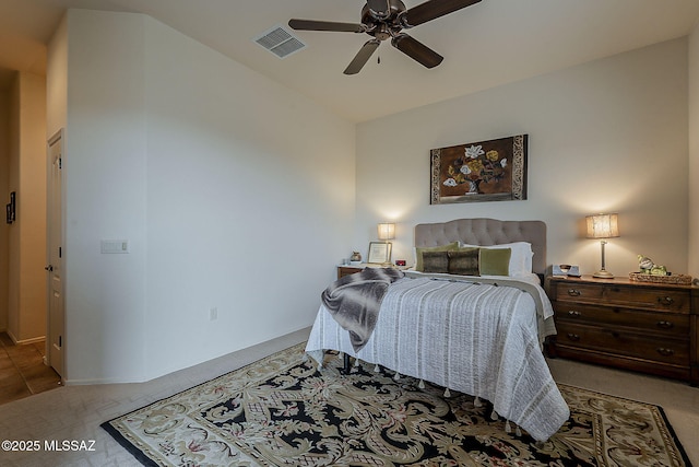 bedroom featuring visible vents, ceiling fan, and carpet floors