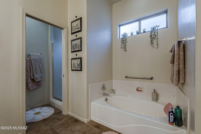 full bathroom with a garden tub, a stall shower, and tile patterned flooring