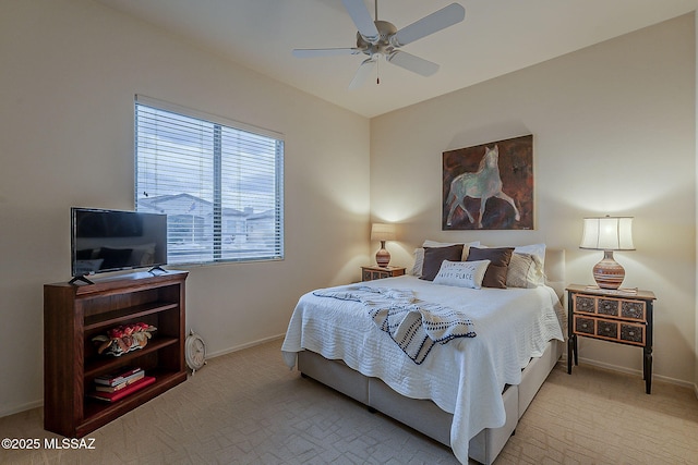 bedroom with baseboards, light carpet, and a ceiling fan