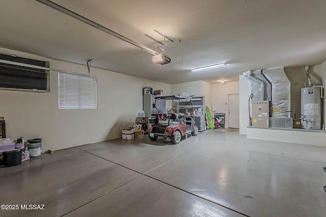 garage featuring water heater and a garage door opener