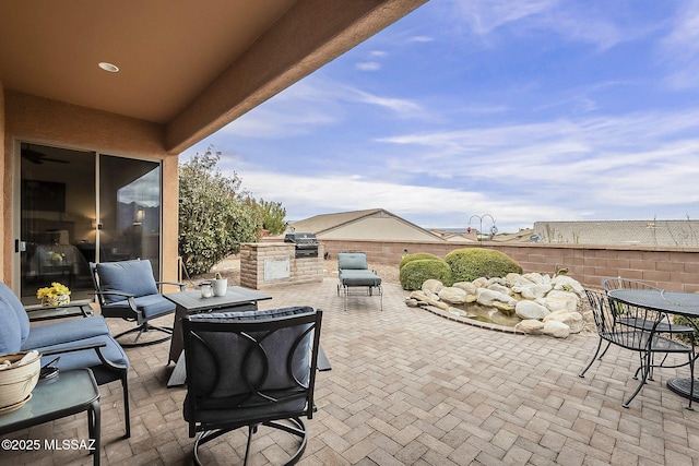 view of patio with outdoor dining area and a grill