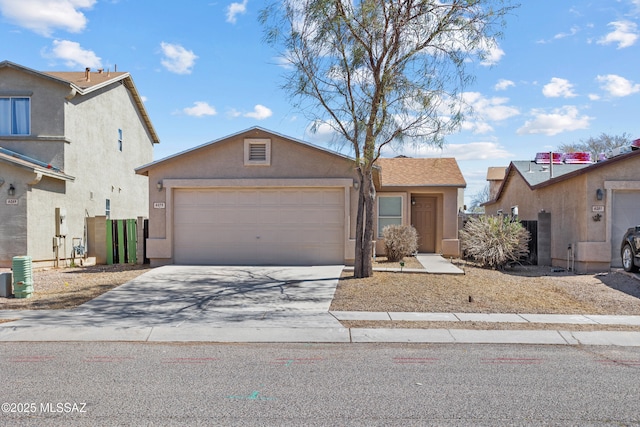 view of front of home featuring stucco siding, an attached garage, and concrete driveway