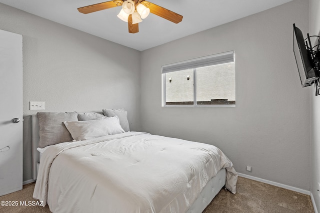 bedroom with baseboards, a ceiling fan, and carpet flooring