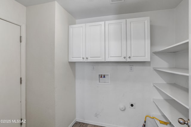 laundry room with baseboards, gas dryer hookup, cabinet space, electric dryer hookup, and washer hookup