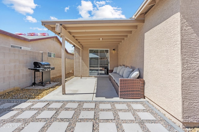 view of patio / terrace featuring area for grilling and fence