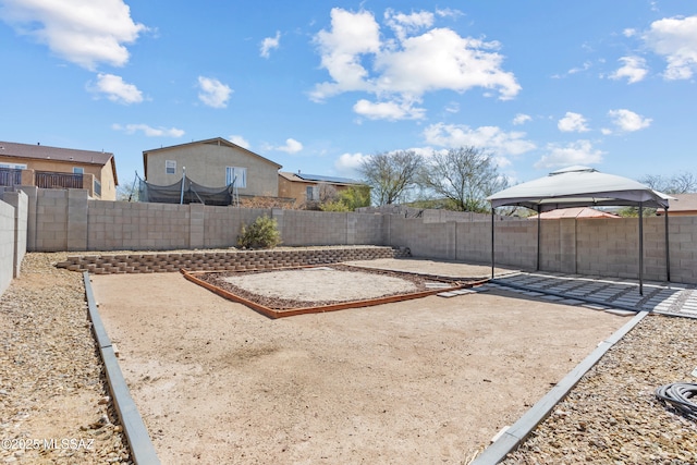 view of yard with a gazebo, a patio area, and a fenced backyard