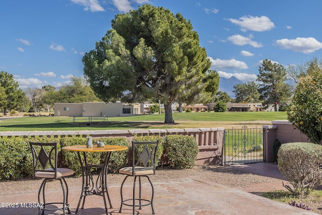 view of patio / terrace featuring fence