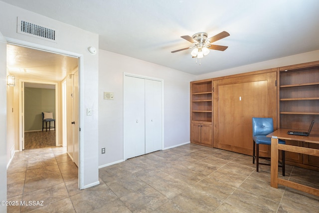 home office with visible vents, baseboards, and ceiling fan