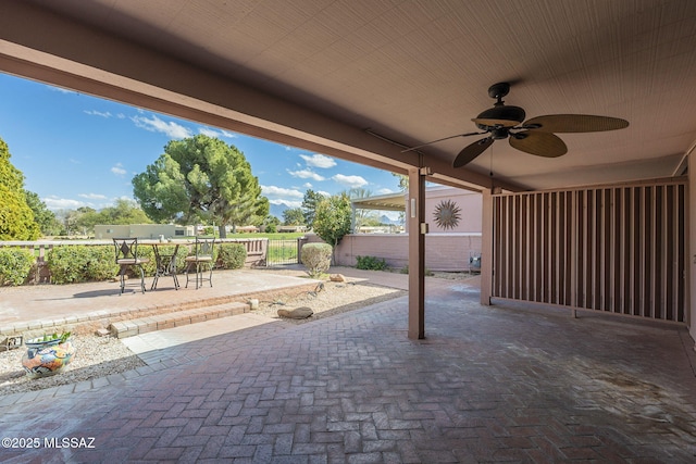 view of patio / terrace featuring outdoor dining space, a ceiling fan, and fence