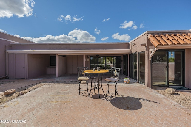 view of patio featuring outdoor dining area