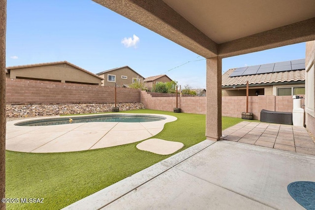 exterior space with a patio area, a fenced in pool, and a fenced backyard