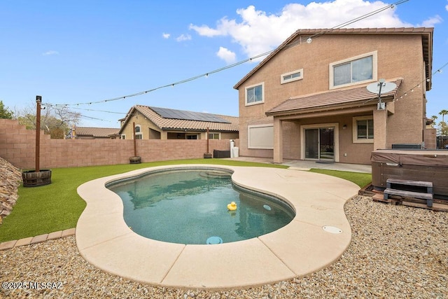 view of pool with a patio, a fenced backyard, and a hot tub