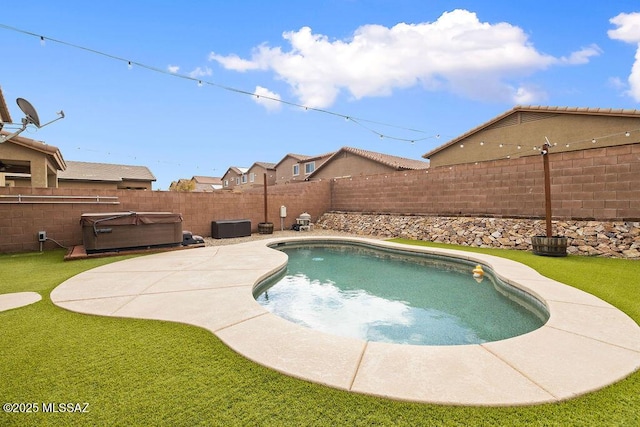 view of pool with a hot tub, a patio, a fenced backyard, a fenced in pool, and a lawn