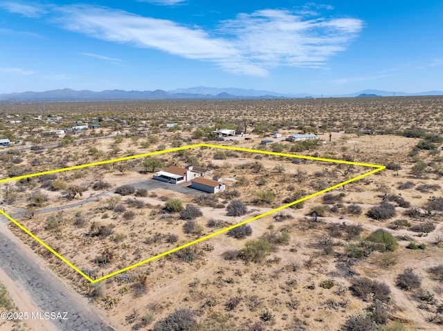 aerial view with a mountain view, a rural view, and a desert view