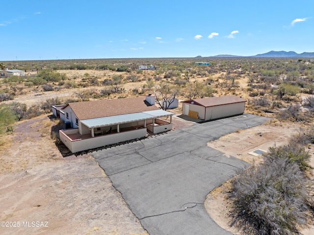 aerial view with a mountain view and a desert view
