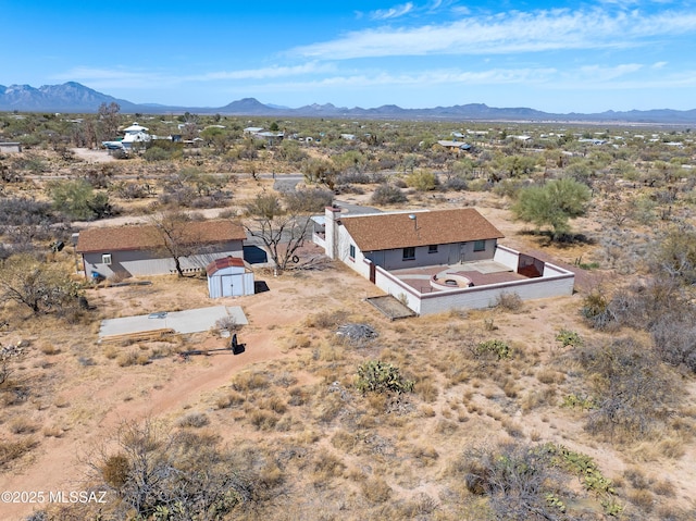 drone / aerial view featuring a mountain view
