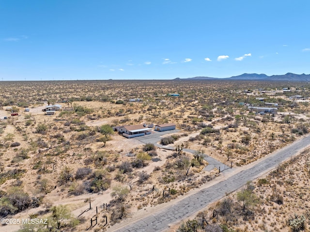 aerial view with a mountain view and view of desert