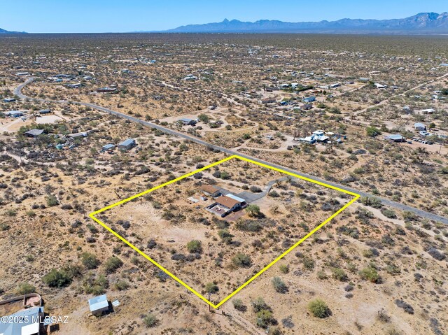 drone / aerial view with a mountain view, a rural view, and a desert view