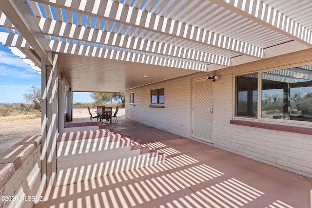 view of patio with outdoor dining area and a pergola