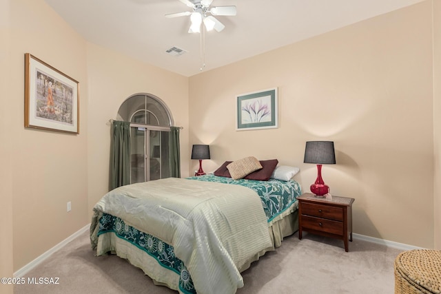 bedroom with baseboards, visible vents, carpet floors, and ceiling fan