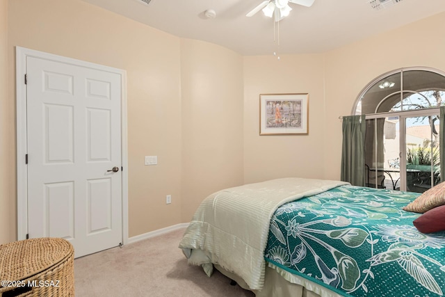 bedroom featuring light carpet, baseboards, a ceiling fan, and access to exterior