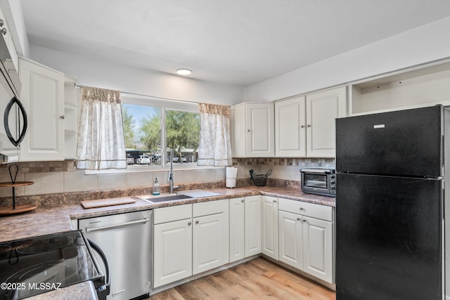 kitchen featuring white cabinetry, black appliances, open shelves, and a sink