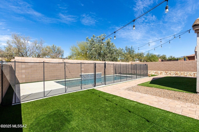 view of swimming pool featuring a fenced backyard, a fenced in pool, a patio, and a yard