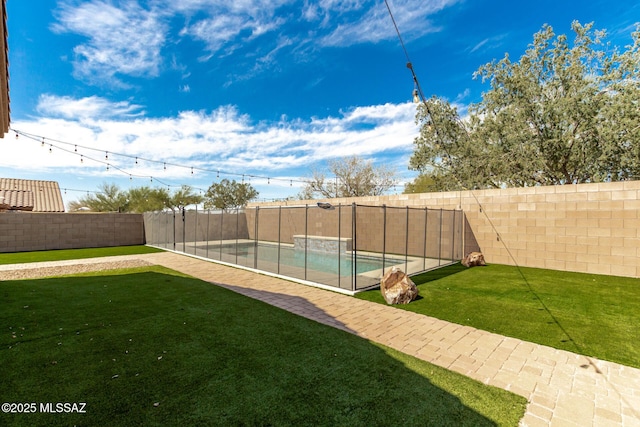 view of yard with a fenced backyard and a fenced in pool