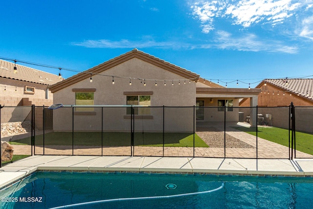 view of swimming pool with a patio area, a fenced backyard, and a fenced in pool