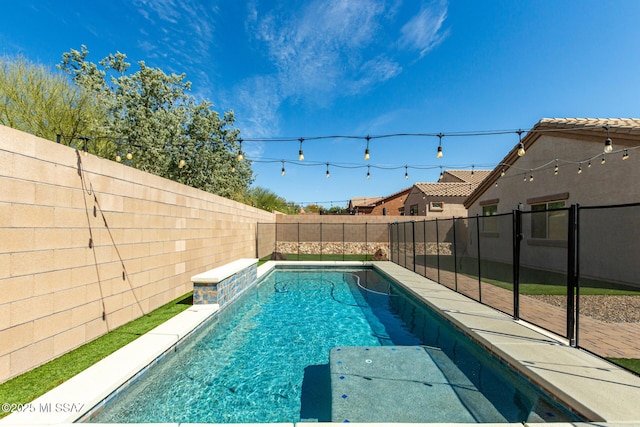 view of swimming pool featuring a fenced backyard and a fenced in pool