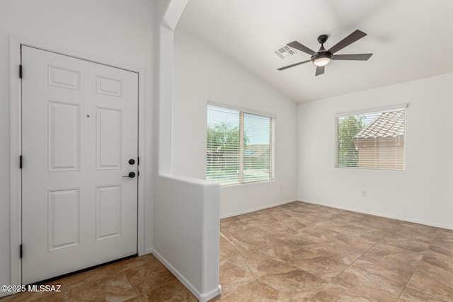 foyer with a ceiling fan, baseboards, visible vents, lofted ceiling, and arched walkways