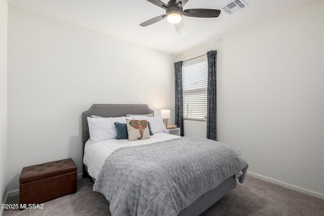 bedroom with visible vents, baseboards, carpet, and ceiling fan