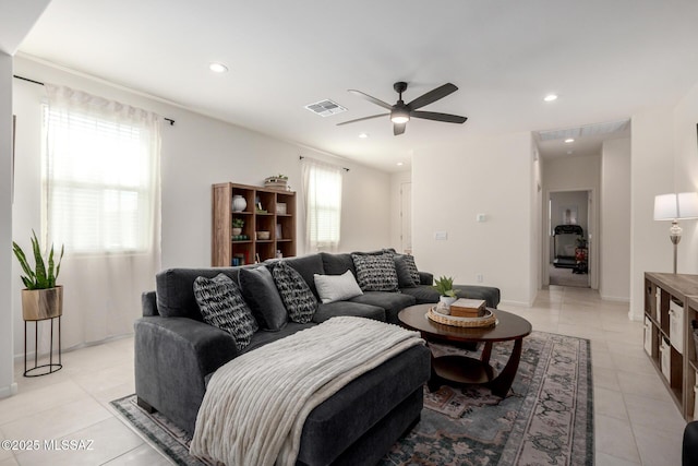 living area with light tile patterned flooring, recessed lighting, visible vents, and ceiling fan