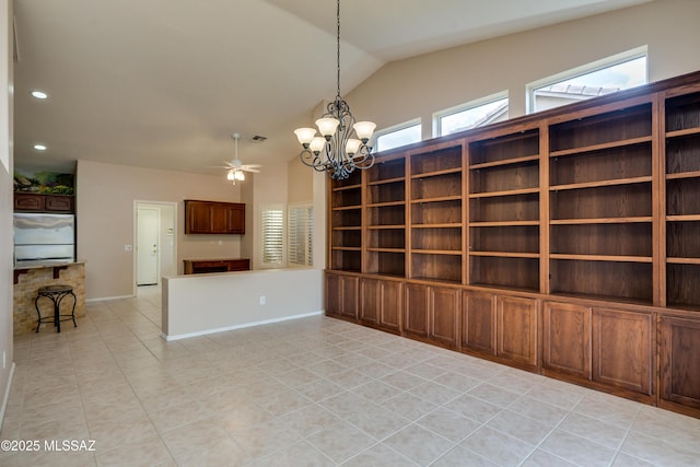 empty room with baseboards, lofted ceiling, light tile patterned floors, recessed lighting, and ceiling fan with notable chandelier