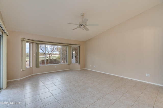 spare room with light tile patterned floors, baseboards, lofted ceiling, and ceiling fan