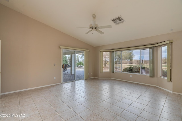 spare room with baseboards, visible vents, light tile patterned flooring, ceiling fan, and vaulted ceiling