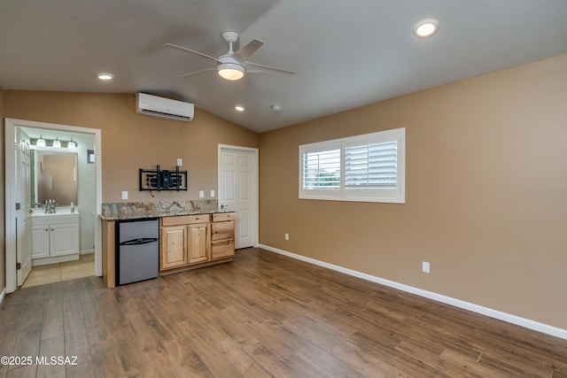 kitchen featuring a wall mounted air conditioner, refrigerator, dark wood-style floors, lofted ceiling, and ceiling fan