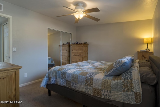 carpeted bedroom with visible vents, baseboards, a closet, and ceiling fan