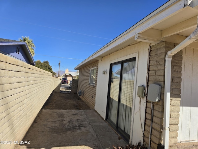 view of property exterior with fence