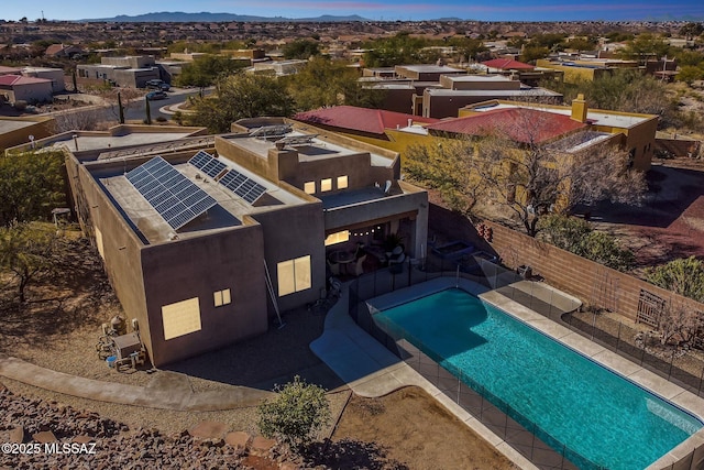 view of pool with a fenced backyard, a fenced in pool, a residential view, a patio area, and a mountain view