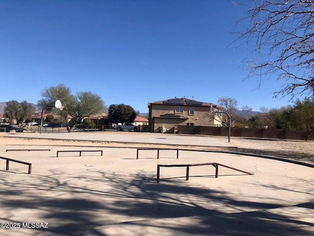 view of community with fence