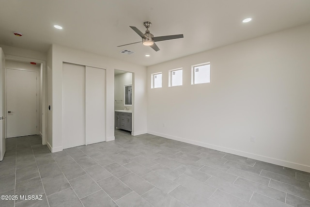 unfurnished bedroom featuring recessed lighting, visible vents, a closet, and baseboards