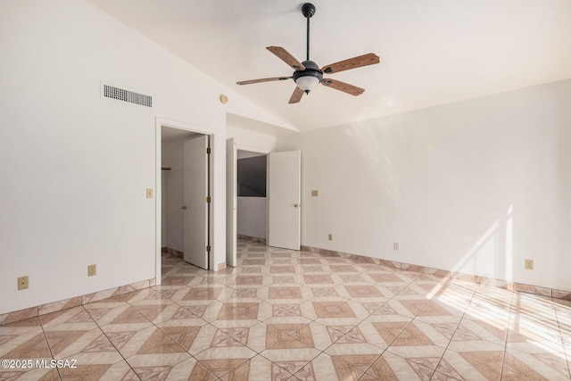 spare room with light tile patterned flooring, visible vents, high vaulted ceiling, and ceiling fan